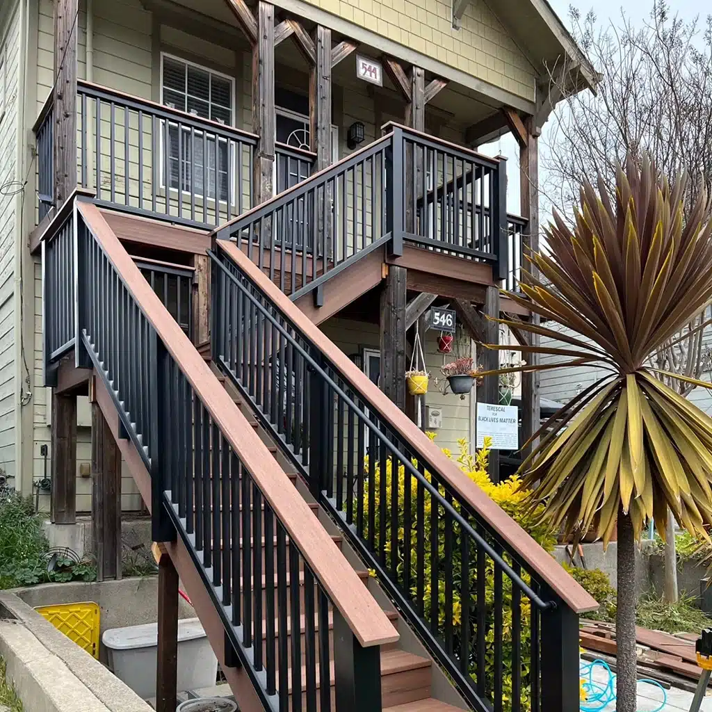 Photo of a porch with railing and steps